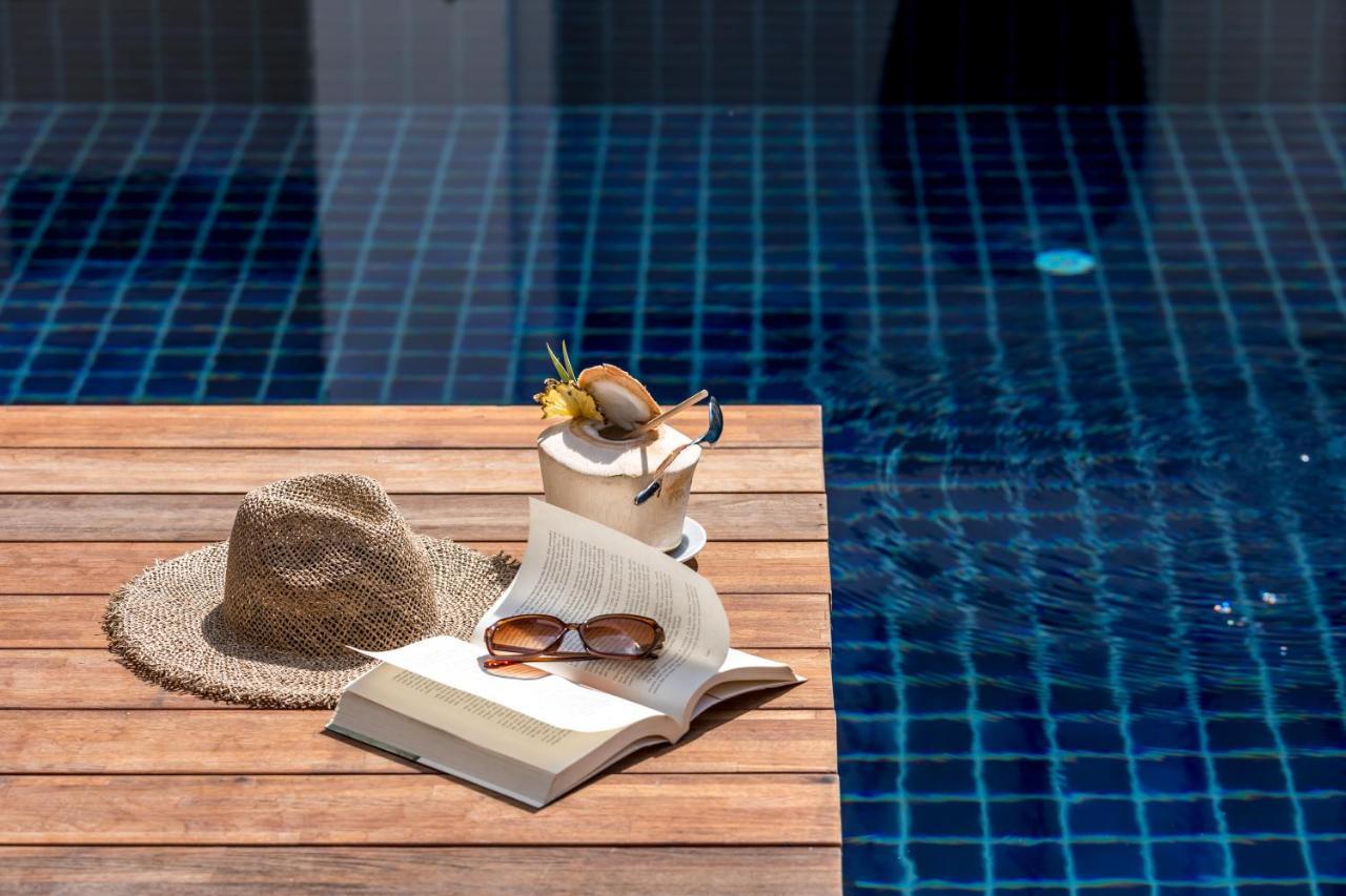 Outrigger Surin Beach Resort - Sha Extra Plus Екстер'єр фото A poolside table