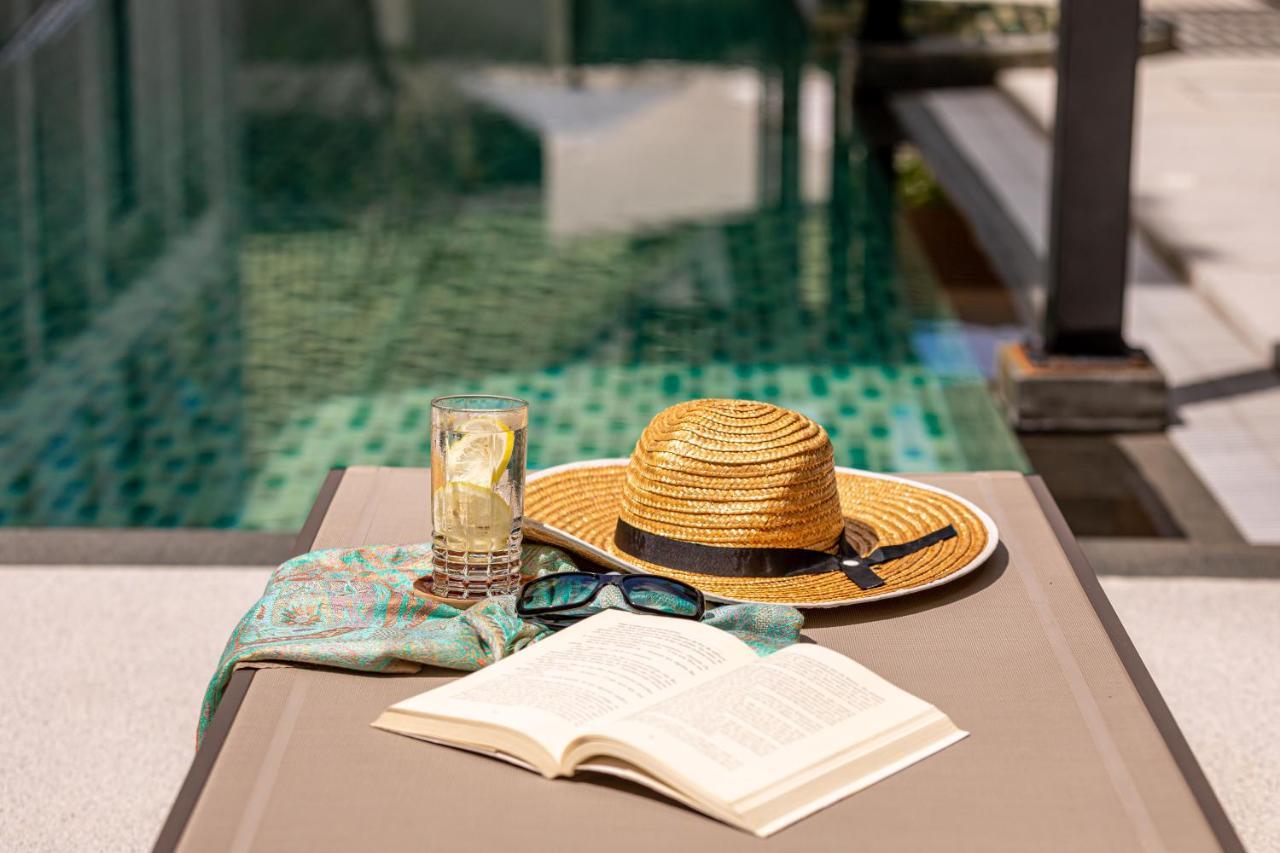 Outrigger Surin Beach Resort - Sha Extra Plus Екстер'єр фото A poolside table