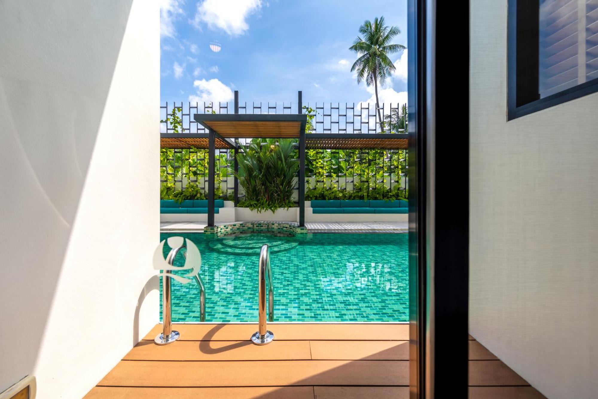 Outrigger Surin Beach Resort - Sha Extra Plus Номер фото The swimming pool at the hotel